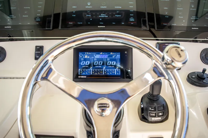 Slide: The Image of Steering wheel and dashboard of a 2020 Scout 380 LXF boat with digital display. - 29