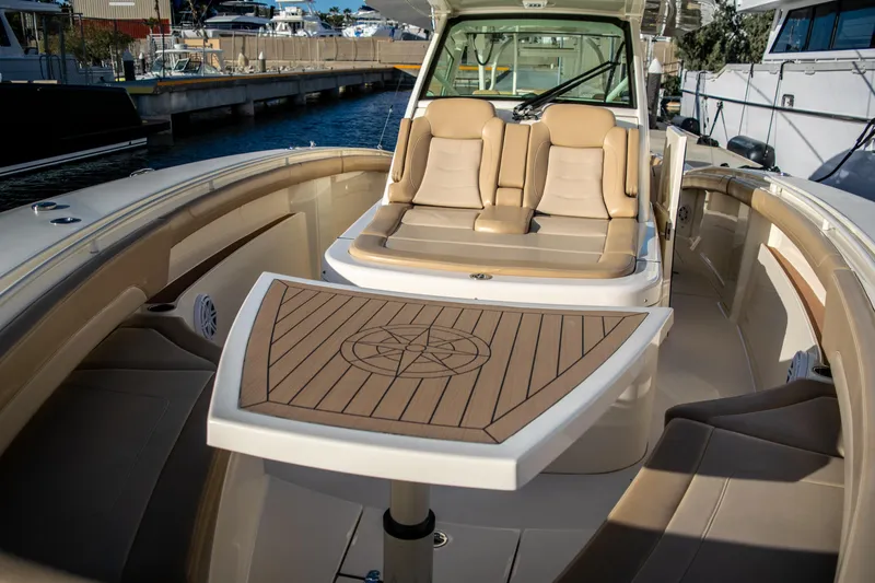 Slide: The Image of 2020 Scout 380 LXF boat interior with seating and table. - 35