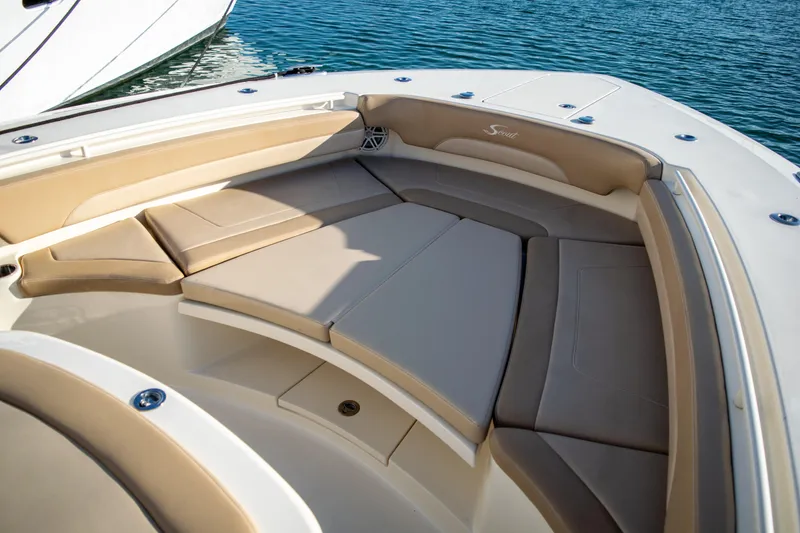 Slide: The Image of 2020 Scout 380 LXF boat with spacious cushioned seating area. - 39