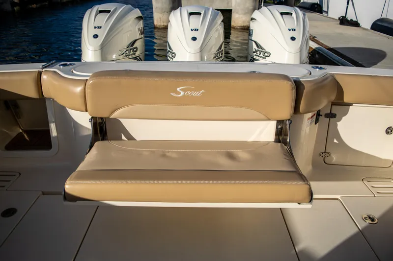 Slide: The Image of 2020 Scout 380 LXF boat with tan seating and triple Yamaha V8 outboard engines. - 41
