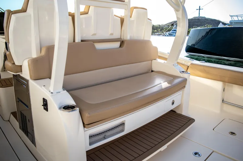 Slide: The Image of 2020 Scout 380 LXF boat interior with tan seating and white accents. - 42