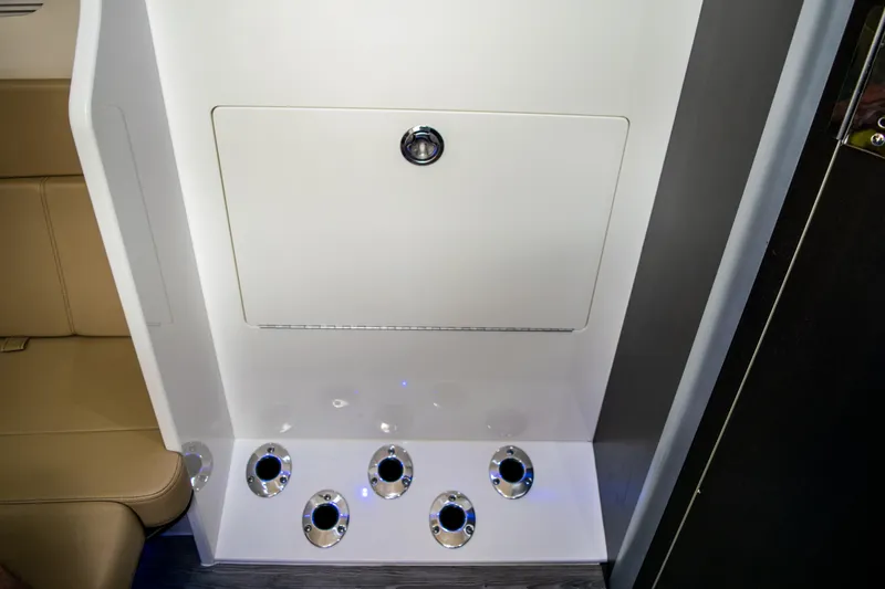 Slide: The Image of Interior of 2020 Scout 380 LXF boat with storage compartment and cup holders. - 46