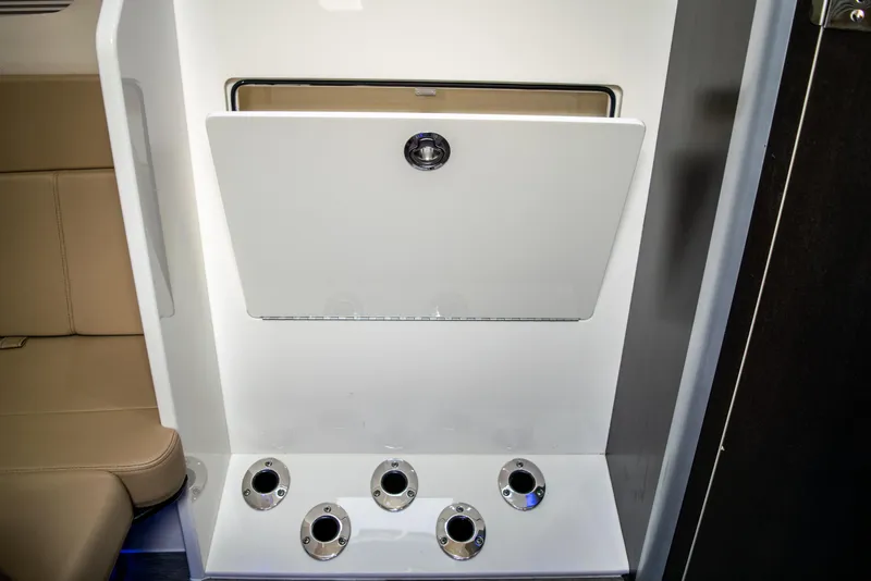 Slide: The Image of 2020 Scout 380 LXF interior storage compartment with rod holders. - 47