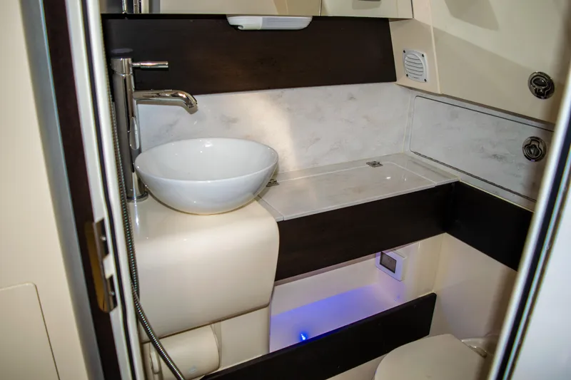 Slide: The Image of 2020 Scout 380 LXF boat bathroom with modern sink and sleek design. - 49