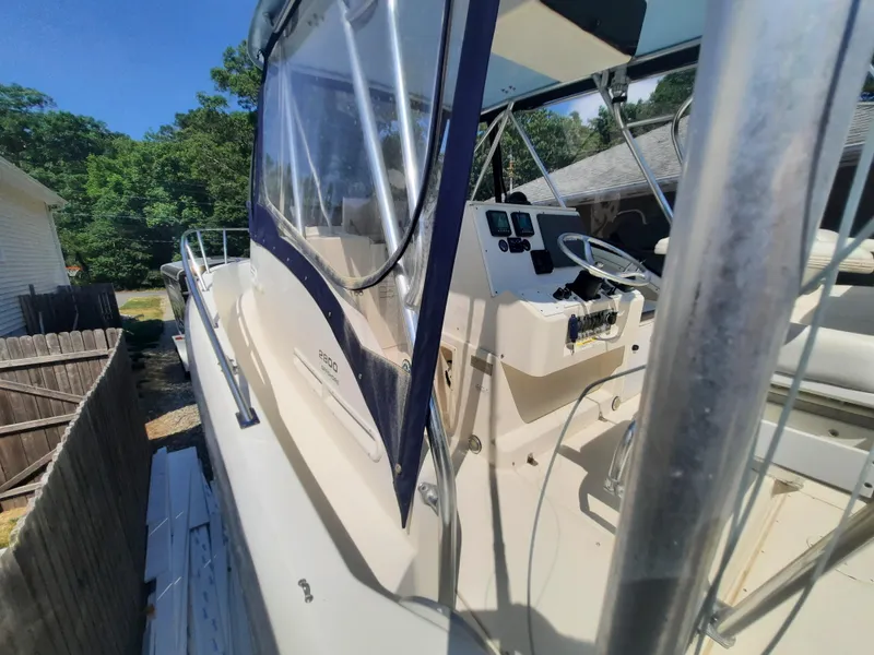 Slide: The Image of 1998 Pursuit 2800 Offshore boat with cockpit and control panel. - 21