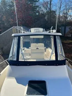 Slide: The Image of 1998 Pursuit 2800 Offshore boat with enclosed cockpit. - 25