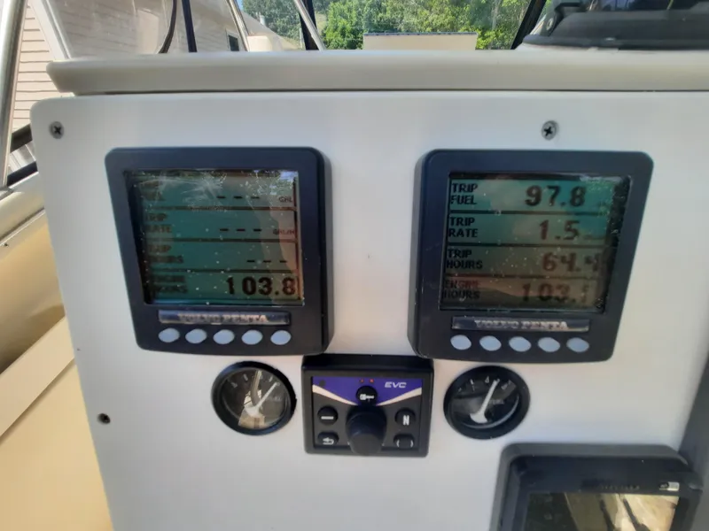 Slide: The Image of Control panel of a 1998 Pursuit 2800 Offshore boat with digital displays. - 31