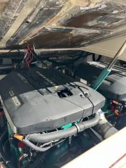 Slide: The Image of 1998 Pursuit 2800 Offshore boat engine compartment with twin engines. - 32