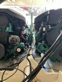 Slide: The Image of 1998 Pursuit 2800 Offshore boat engine compartment with dual engines. - 34