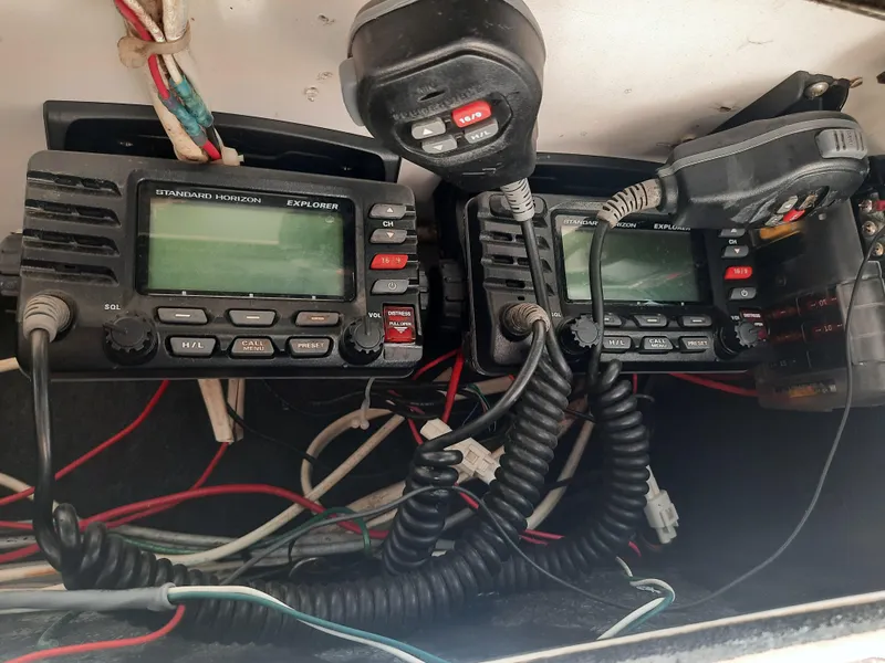 Slide: The Image of VHF radios and wiring on a 1998 Pursuit 2800 Offshore boat. - 36