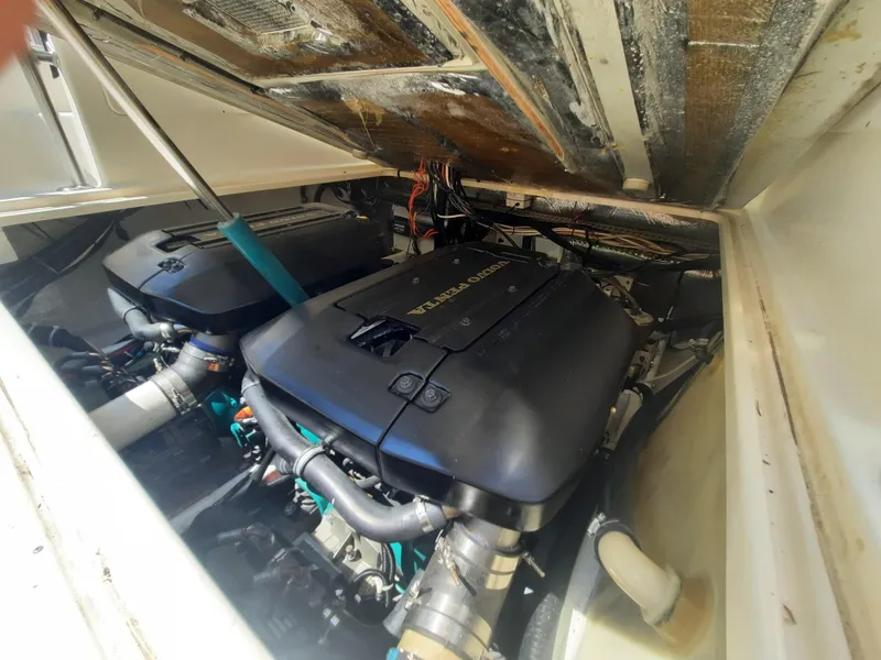 Slide: The Image of 1998 Pursuit 2800 Offshore boat engine compartment with twin engines. - 37