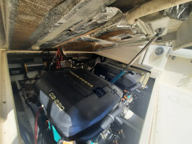 Slide: The Image of 1998 Pursuit 2800 Offshore boat engine compartment with Volvo Penta D9-220 engines. - 38