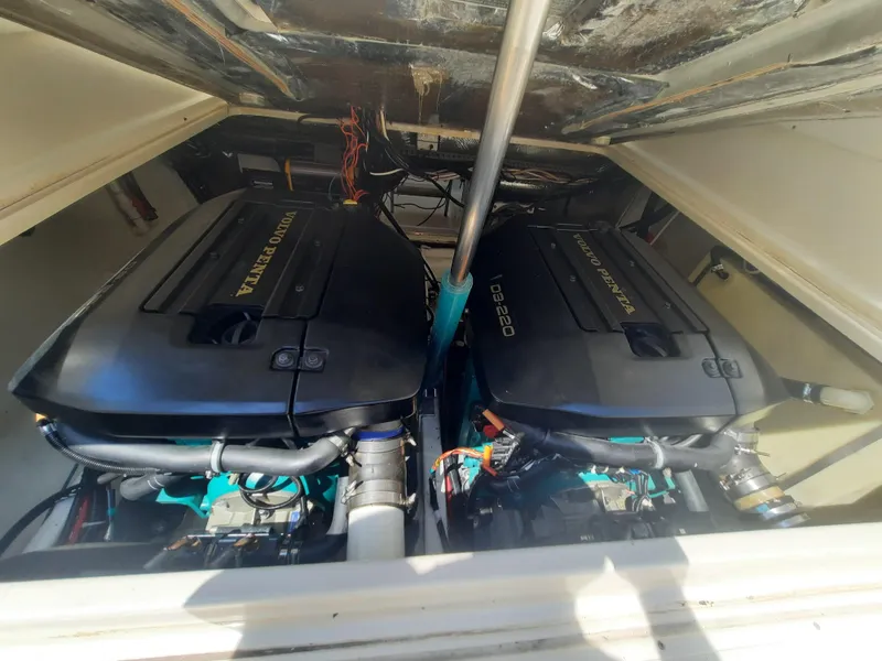 Slide: The Image of Twin engines of a 1998 Pursuit 2800 Offshore boat. - 39