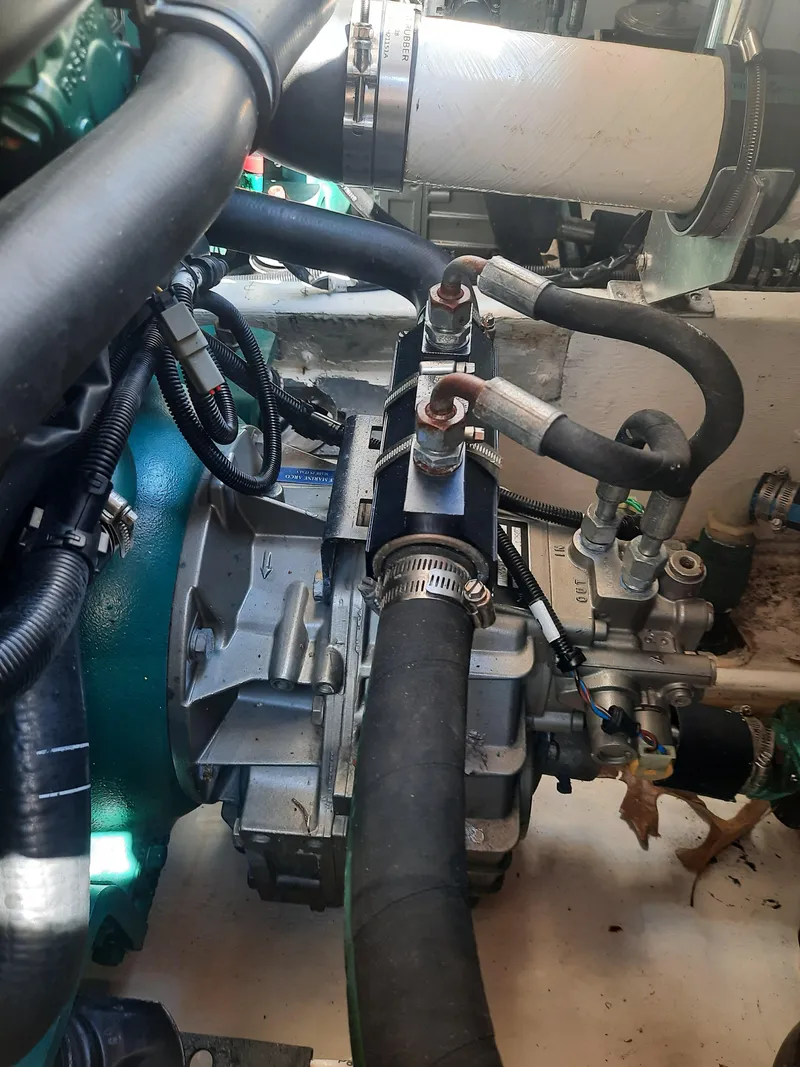 Slide: The Image of Engine compartment of a 1998 Pursuit 2800 Offshore boat showing hoses and mechanical components. - 41