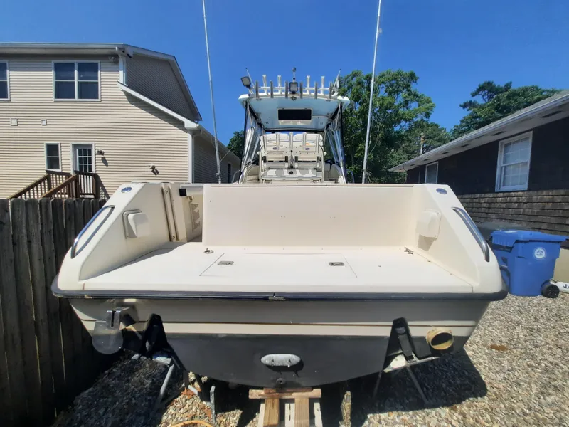 Slide: The Image of 1998 Pursuit 2800 Offshore boat in a residential backyard. - 7