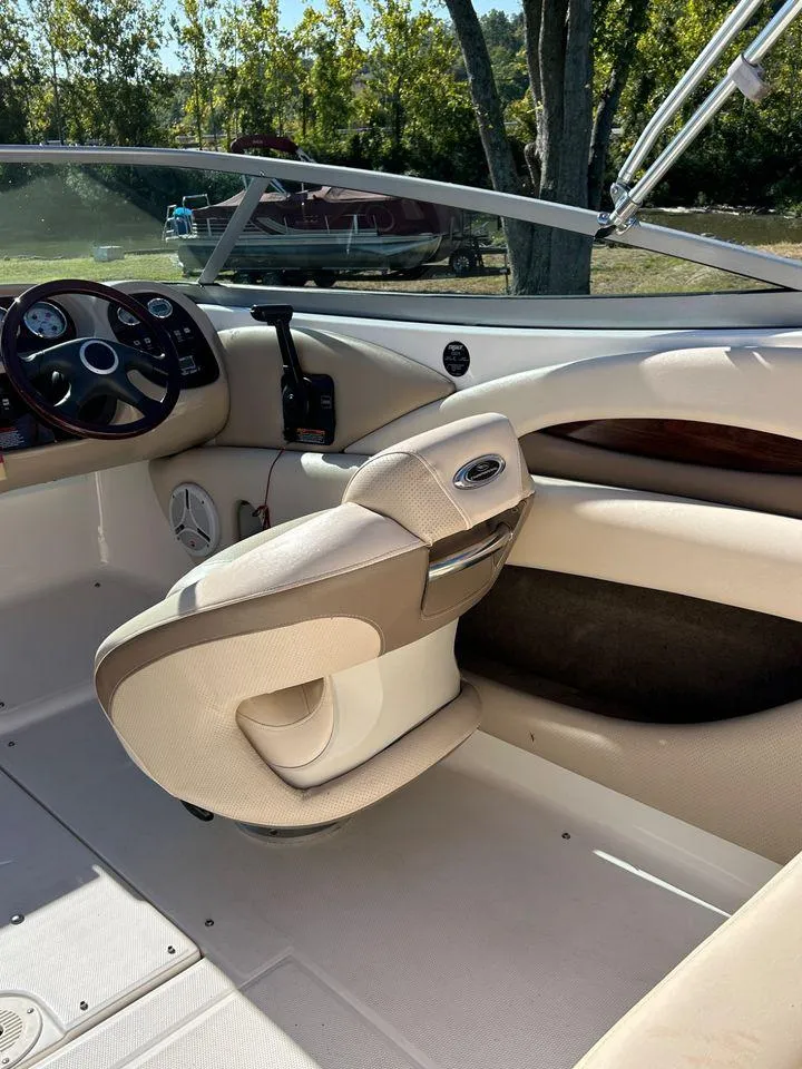 Slide: The Image of 2006 Chaparral 210 SSi boat interior with steering wheel and seating. - 10