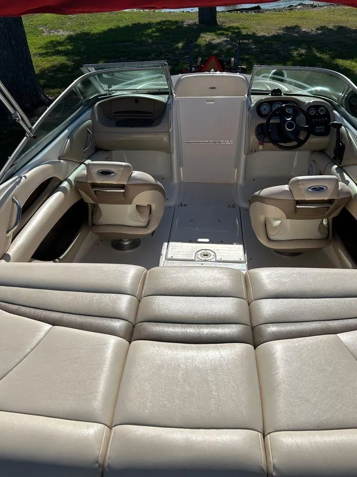 Slide: The Image of 2006 Chaparral 210 SSi boat interior with beige leather seating and dashboard. - 17