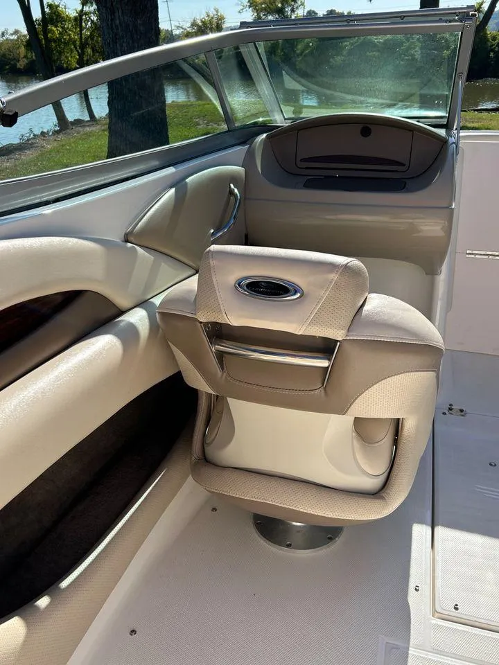 Slide: The Image of 2006 Chaparral 210 SSi boat interior with beige seating and windshield. - 9