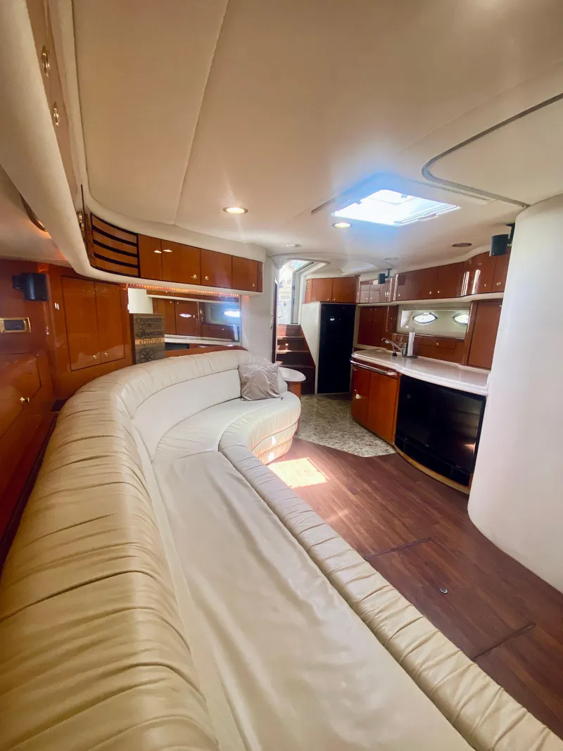 Slide: The Image of Luxurious interior of 2001 Sea Ray 540 Sundancer yacht with leather seating and modern kitchen. - 12