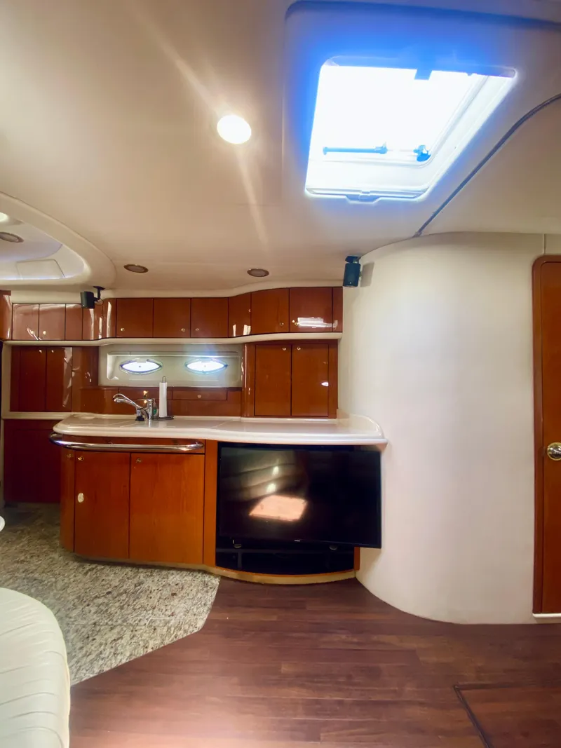 Slide: The Image of Interior of 2001 Sea Ray 540 Sundancer yacht with modern kitchen and skylight. - 15