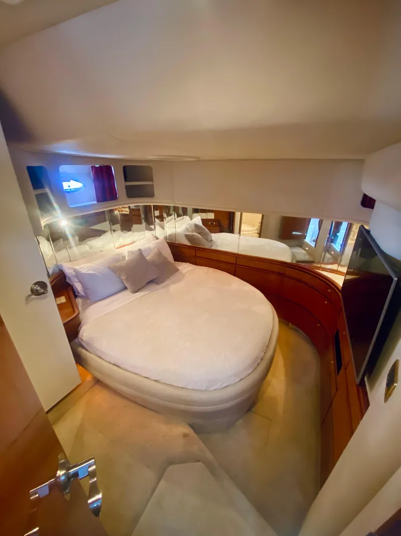 Slide: The Image of Luxurious bedroom interior of 2001 Sea Ray 540 Sundancer yacht with mirrored walls. - 20