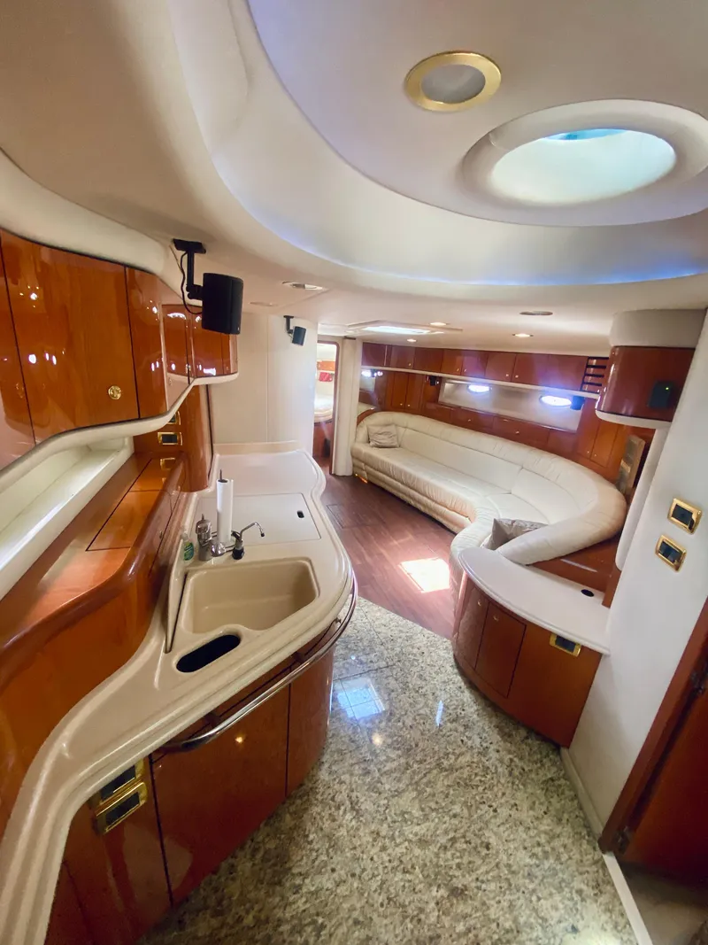 Slide: The Image of Luxurious interior of 2001 Sea Ray 540 Sundancer yacht with modern amenities and elegant design. - 9