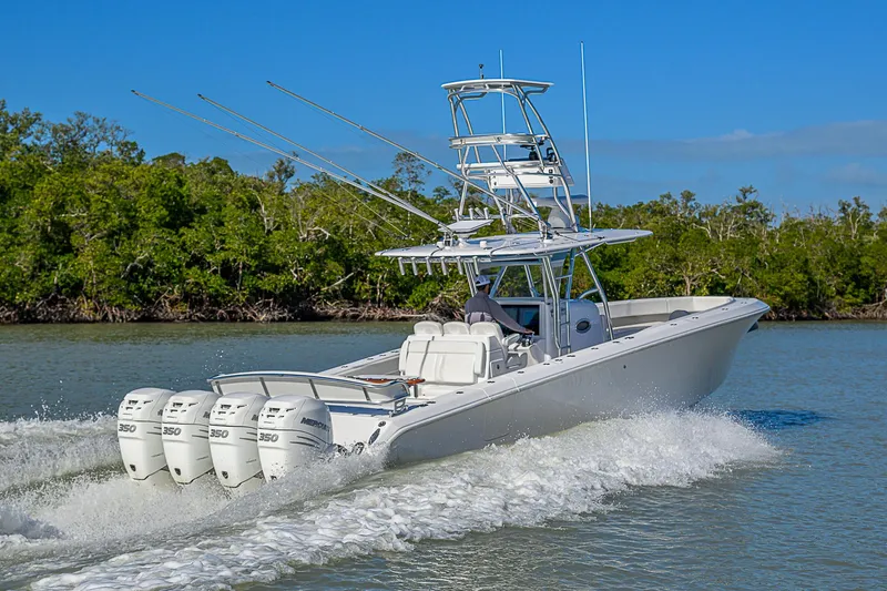 Slide: The Image of 2019 Bahama 41 boat cruising on water with four powerful engines. - 13