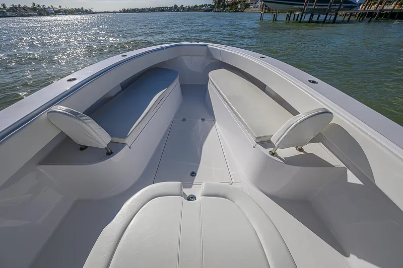 Slide: The Image of 2019 Bahama 41 boat interior with seating, on calm water. - 20