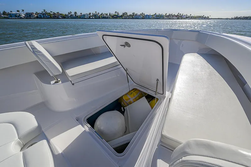 Slide: The Image of 2019 Bahama 41 boat with open storage compartment on deck, near water. - 22