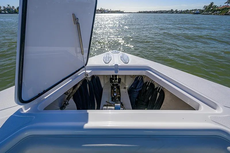 Slide: The Image of Open storage compartment on 2019 Bahama 41 boat, with scenic water view. - 27