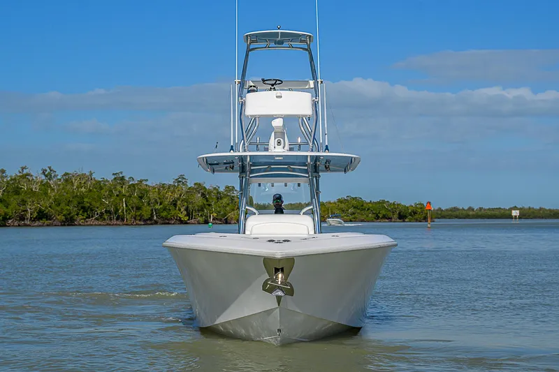 Slide: The Image of Front view of a 2019 Bahama 41 boat on calm water, clear sky background. - 3