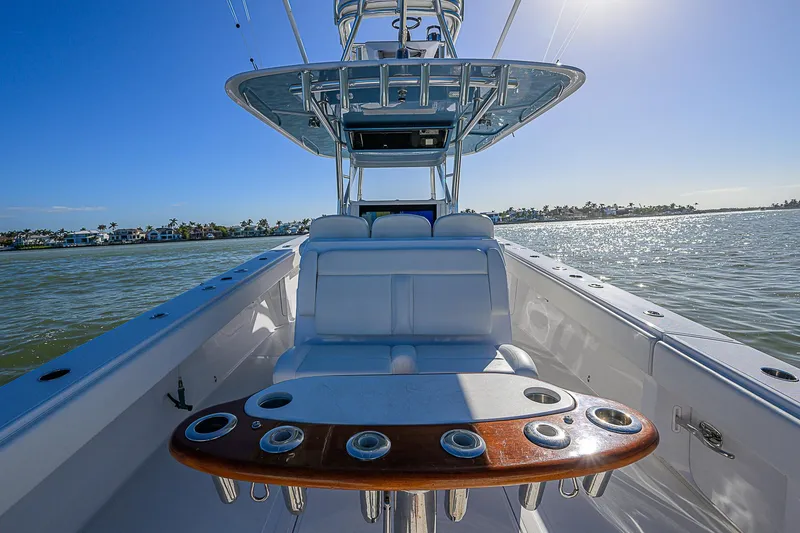 Slide: The Image of 2019 Bahama 41 boat with seating and rod holders on a sunny day. - 36