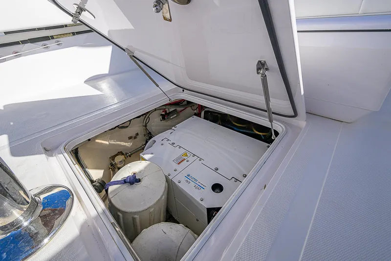 Slide: The Image of Open hatch revealing engine compartment of 2019 Bahama 41 boat. - 43