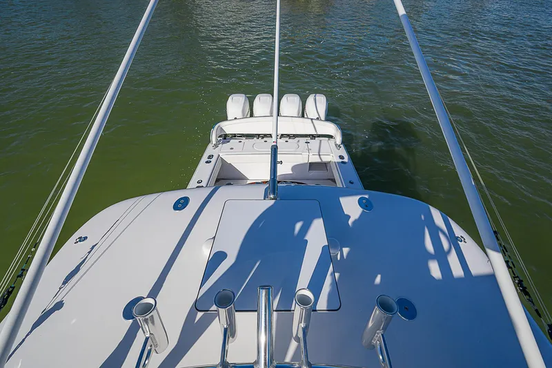 Slide: The Image of 2019 Bahama 41 boat with multiple engines, viewed from above on water. - 48