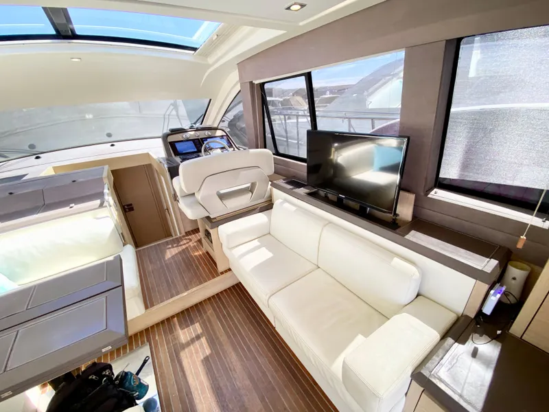 Slide: The Image of Luxurious interior of 2015 Monte Carlo MC5S yacht with white seating and modern amenities. - 13