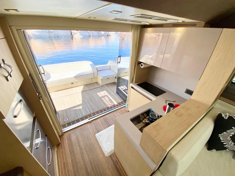 Slide: The Image of Luxurious interior of 2015 Monte Carlo MC5S yacht with open deck view. - 14