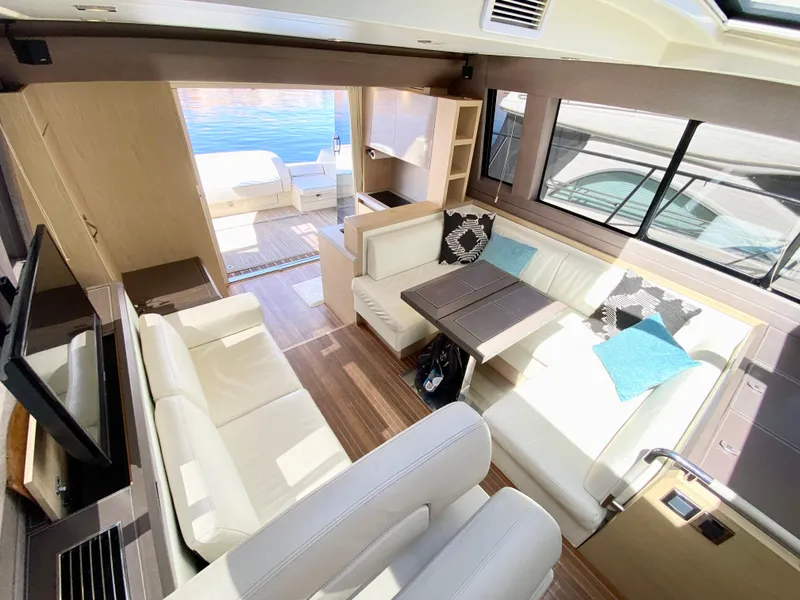 Slide: The Image of Luxurious interior of 2015 Monte Carlo MC5S yacht with elegant seating and dining area. - 18