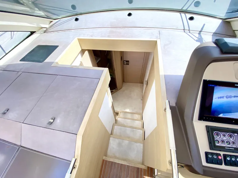 Slide: The Image of Interior view of 2015 Monte Carlo MC5S yacht, featuring stairs and control panel. - 19