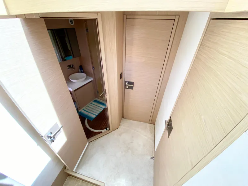 Slide: The Image of Modern bathroom interior in 2015 Monte Carlo MC5S yacht, featuring sleek design and light wood finishes. - 21