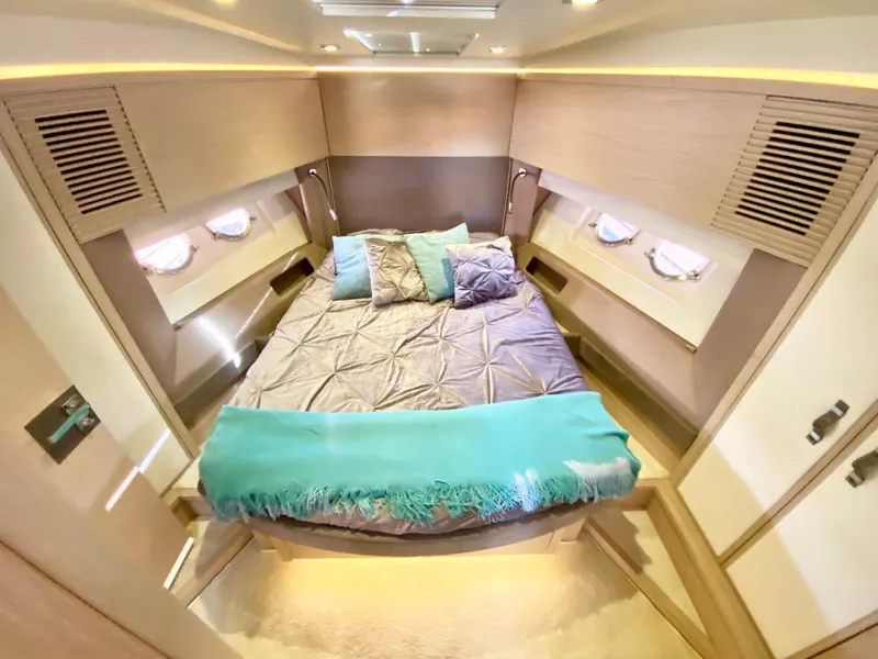 Slide: The Image of Luxurious 2015 Monte Carlo MC5S yacht bedroom with elegant bedding and ambient lighting. - 22