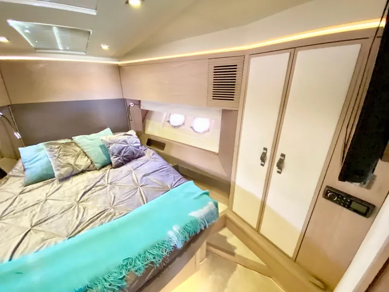 Slide: The Image of Luxurious 2015 Monte Carlo MC5S yacht bedroom with modern design and cozy bedding. - 23