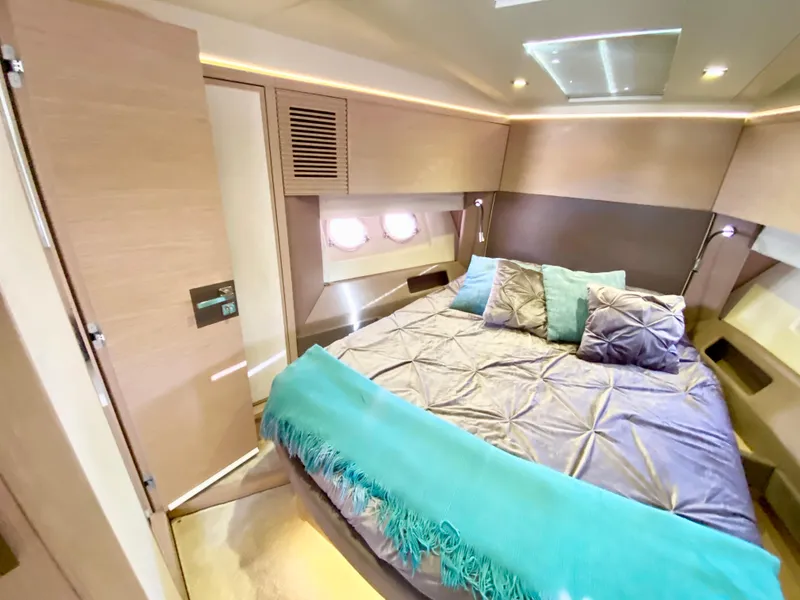 Slide: The Image of Luxurious 2015 Monte Carlo MC5S yacht bedroom with modern decor and cozy bedding. - 24