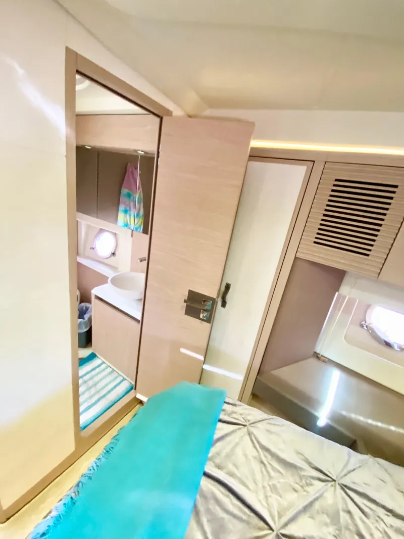 Slide: The Image of 2015 Monte Carlo MC5S yacht interior with modern bedroom and bathroom design. - 25