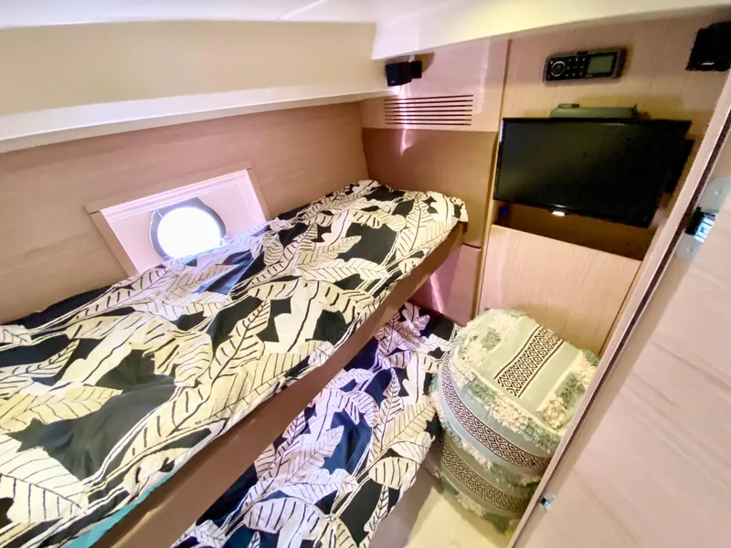 Slide: The Image of Cozy cabin interior of 2015 Monte Carlo MC5S with bunk beds and porthole window. - 31