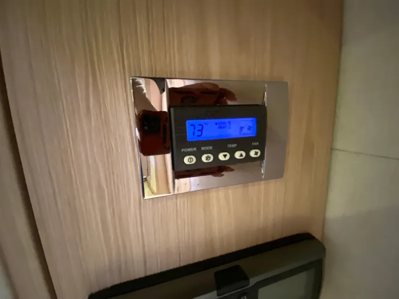 Slide: The Image of Digital thermostat on Monte Carlo MC5S yacht, 2015 model, displaying temperature settings. - 33