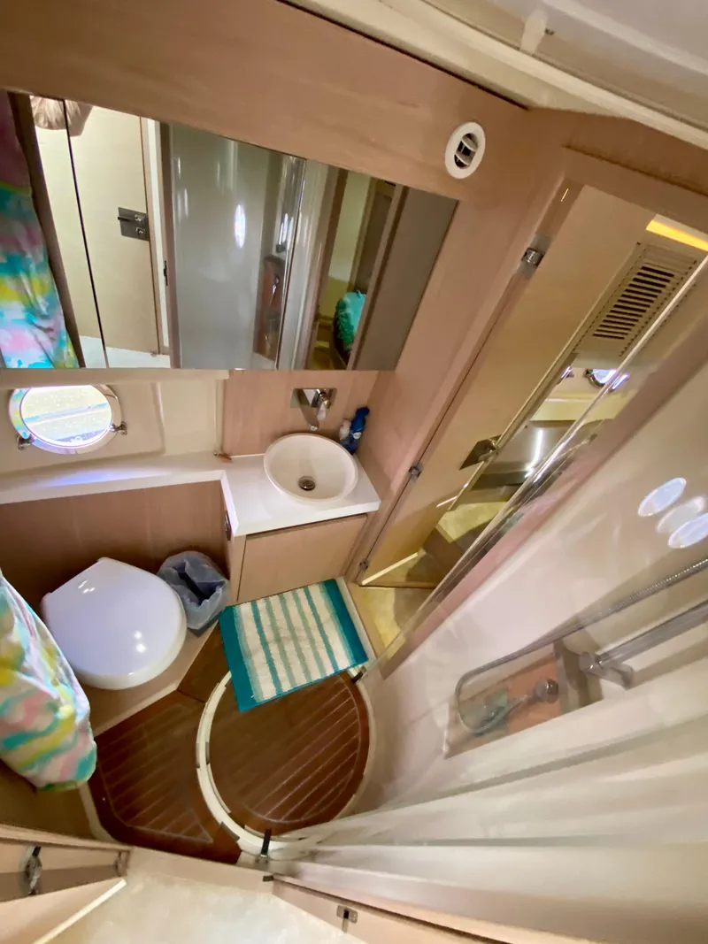 Slide: The Image of 2015 Monte Carlo MC5S yacht bathroom with shower, sink, and toilet. - 46