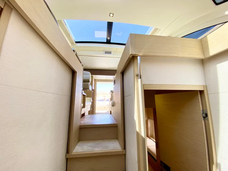Slide: The Image of Interior of 2015 Monte Carlo MC5S yacht with skylight and modern wooden design. - 47