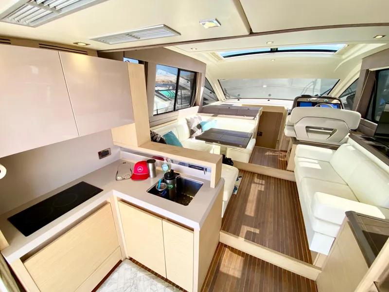 Slide: The Image of Luxurious interior of 2015 Monte Carlo MC5S yacht with modern kitchen and seating area. - 10