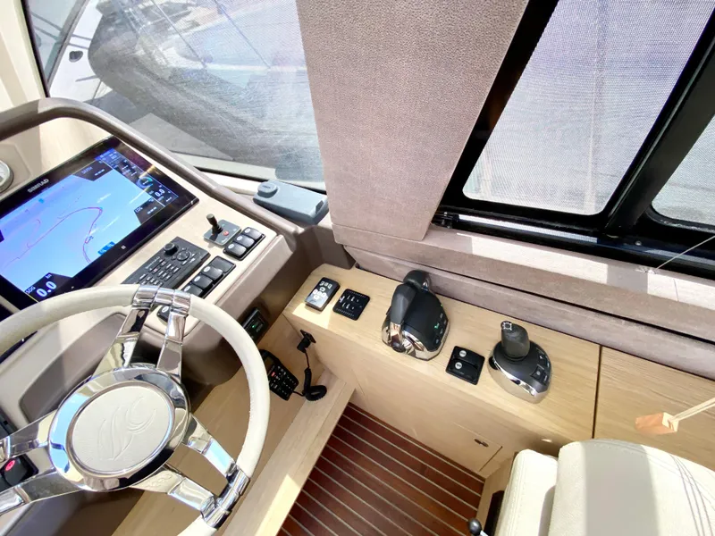Slide: The Image of Cockpit of 2015 Monte Carlo MC5S yacht with modern controls and navigation system. - 16
