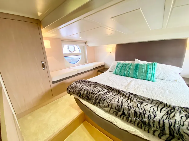 Slide: The Image of Luxurious bedroom interior of 2015 Monte Carlo MC5S yacht with modern design and cozy bedding. - 36